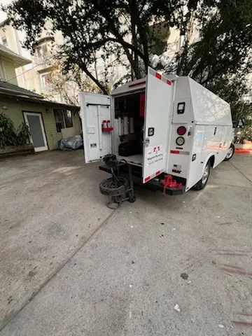 Magnet Plumbing service vehicle on-site for Grease Trap Cleaning in Hancock